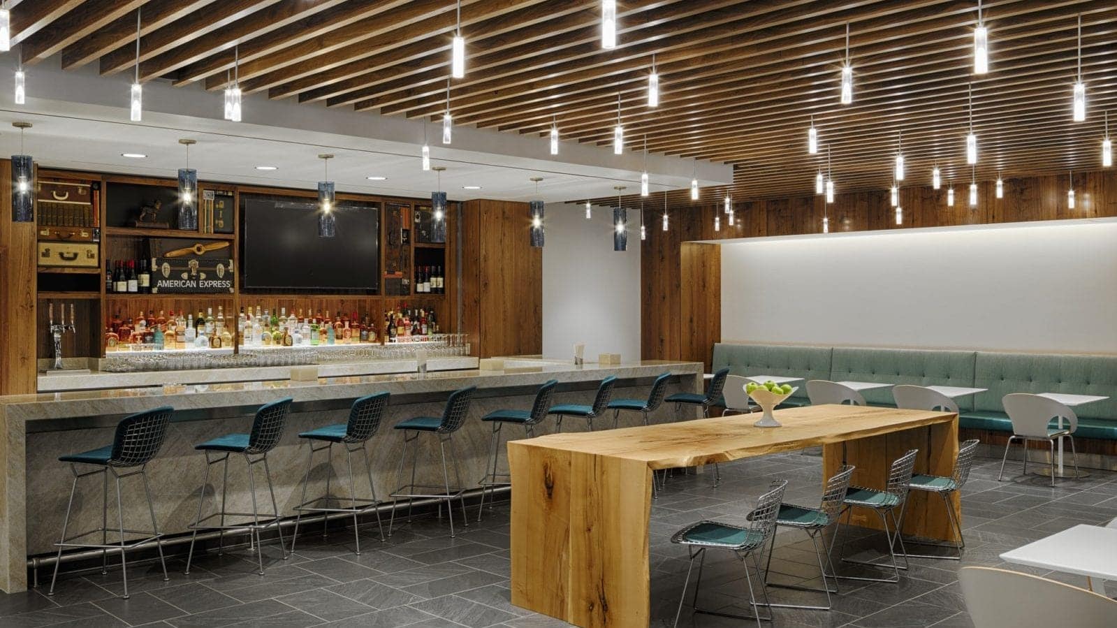 A bar and dining area at the AMEX Centurion Lounge