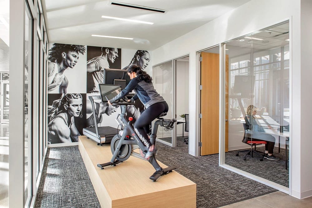 Large-scale wall graphics at the Peloton Customer Care Center.