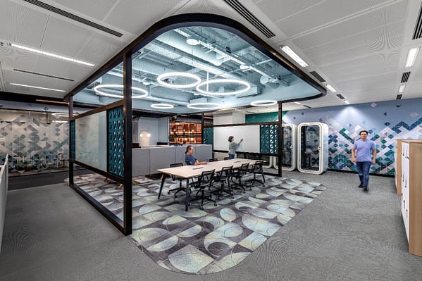 A corporate workplace featuring soft services, adjustable lighting, and nearby areas for breaks.