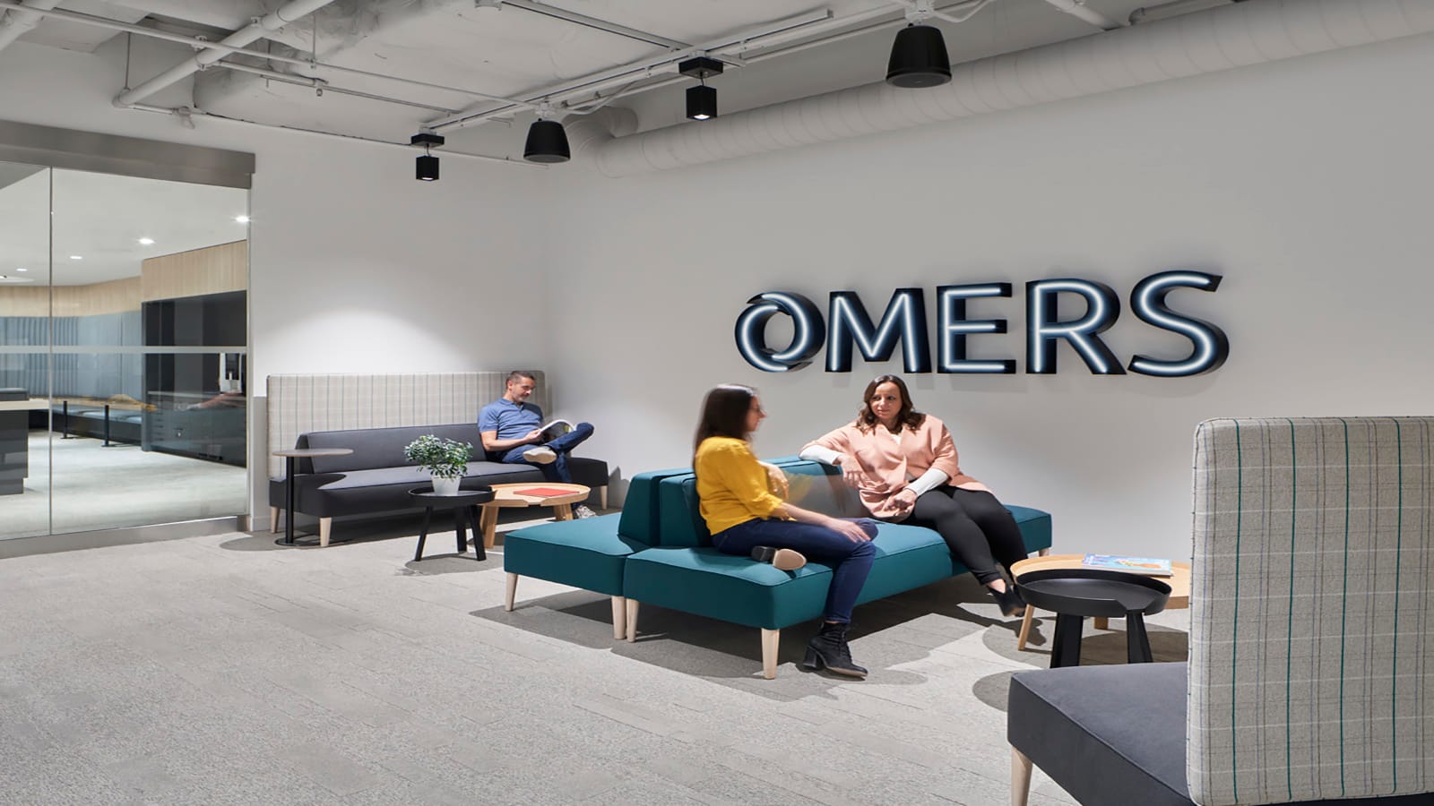 A comfortable seating area awaits guests at the OMERS workplace
