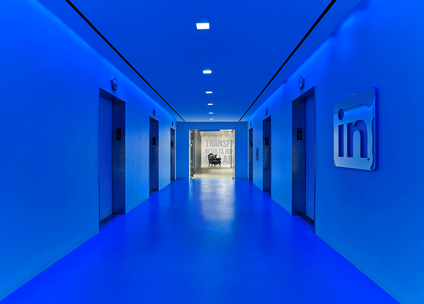An elevator well glows with iconic LinkedIn blue in New York, signifying brand from any entry point. Photo by Eric Laignel. 