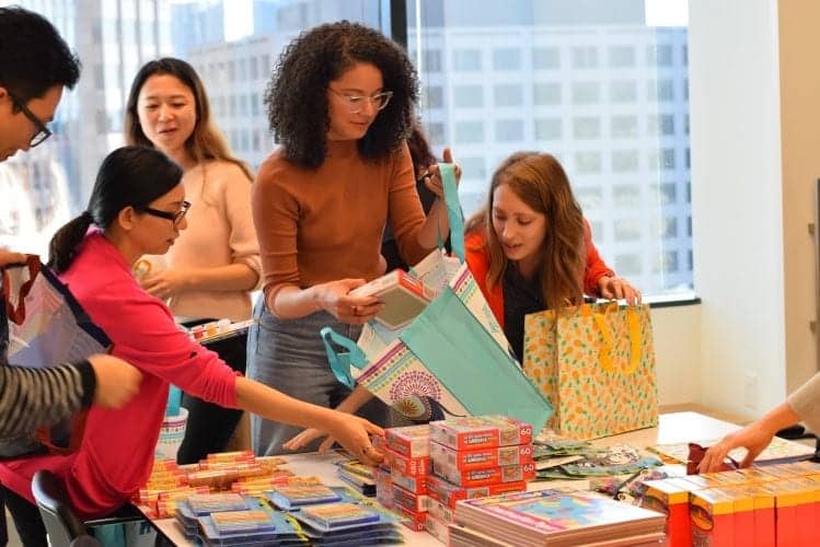 IA's Los Angeles team puts together books and other literacy tools for the United Way